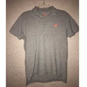 Grey polo with orange details